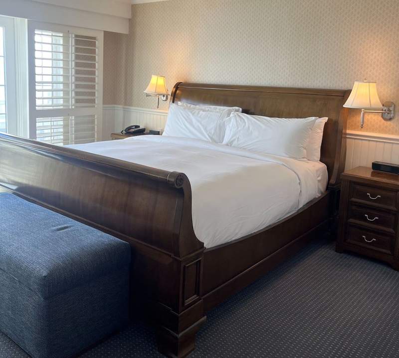 King bed in guest room at Madison Beach Hotel in Connecticut