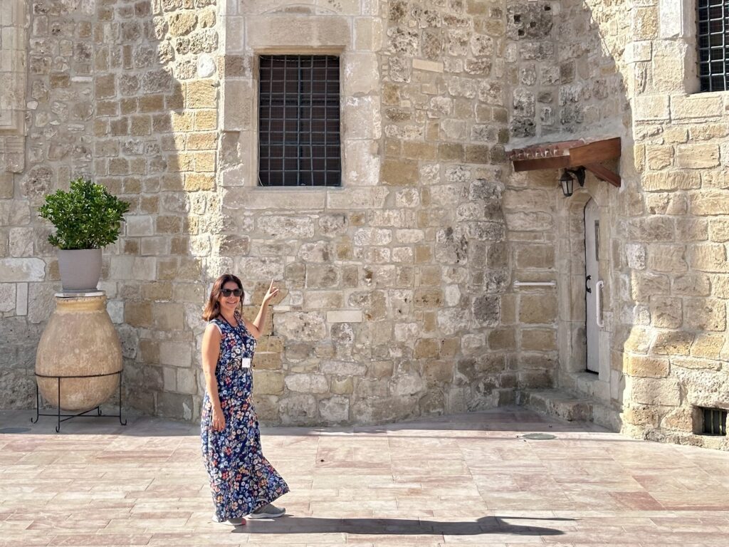 Female tour guide outside the Church of Saint Lazarus in Larnaca, Cyprus.