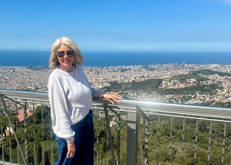 woman overlooking the city of Barcelona from a hilltop viewpoint in Spain