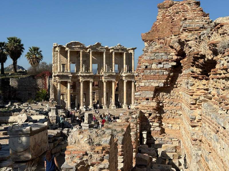 Overlooking a ruined wall at the ruins of the ancient Library of Celsus in Ephesus.