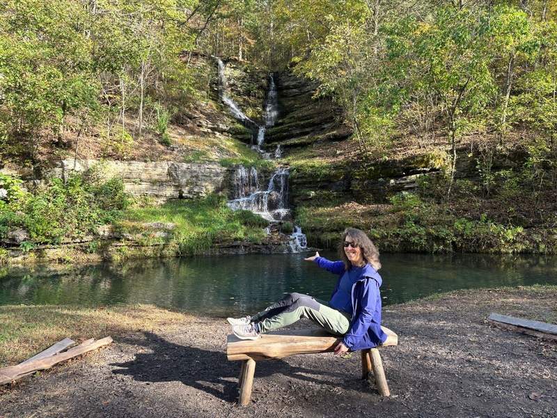 Sitting on a bench near a waterfall