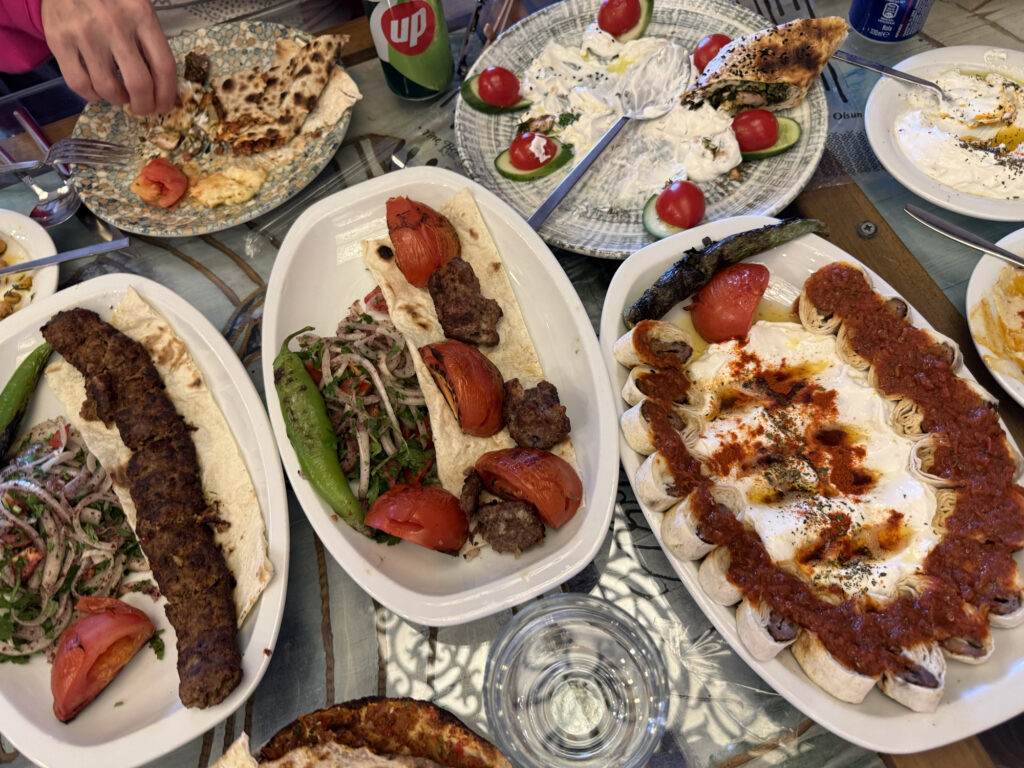 A beautiful and delicious spread of various kabobs and side dishes at Babadan Lezzetler Usta Isleri.