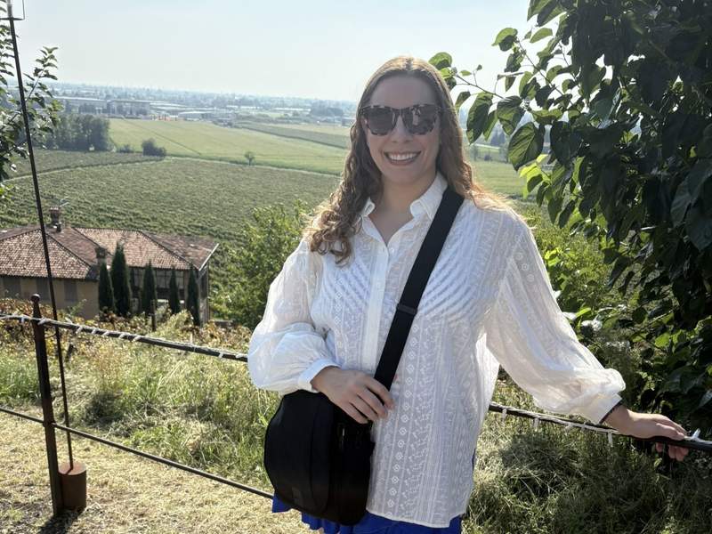 Author posing before spa