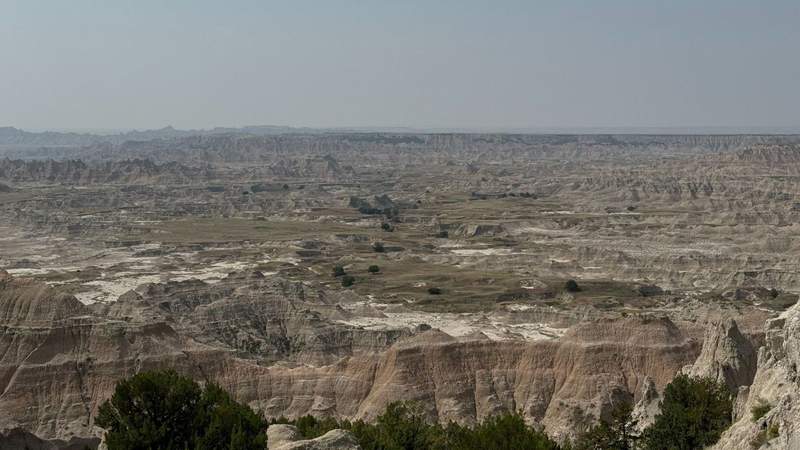 red and orange rock formations across the span of miles at Badlands National Park.