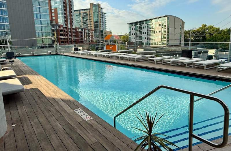 The pool is a deep blue almost merging with Nashville's skyline.