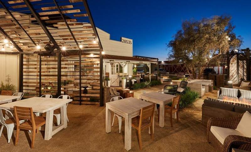 Restaurant tables on the outdoor patio at Small Barn restaurant in Old Town.