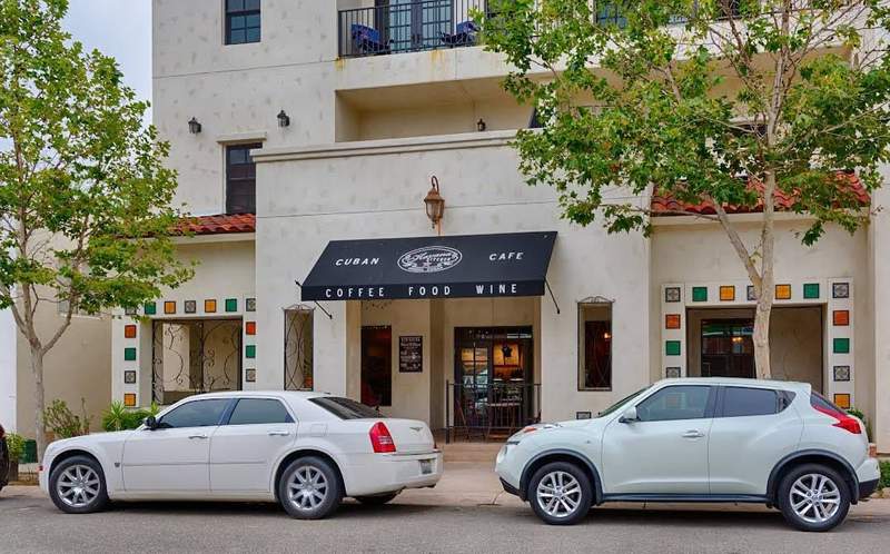 Two cars parked in front of Havana Kitchen in Temecula.