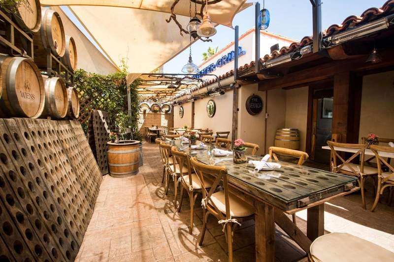 Wine barrels and wooden wine racks accent the back patio at Bluewater Grill in Temecula.