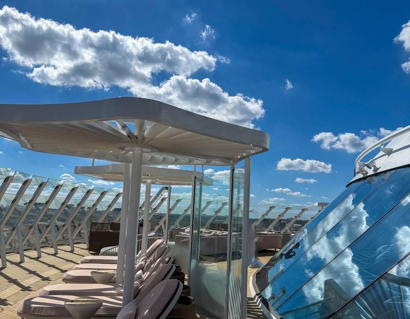 chaise lounges on a cruise ship rooftop deck