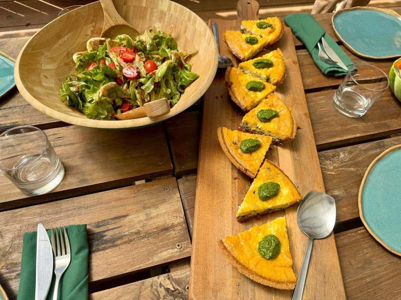 Quiche and sala on a picnic table