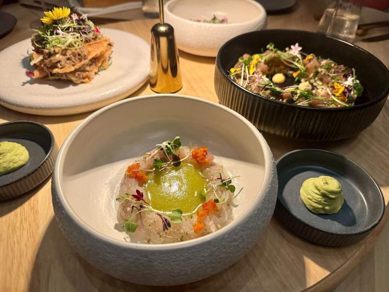 Artistic dishes displayed in bowls on a lazy Susan