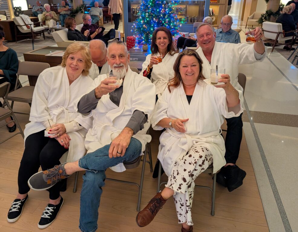 passengers dressed in bathroom toasting the photographer aboard the Viking Mississippi River cruise boat