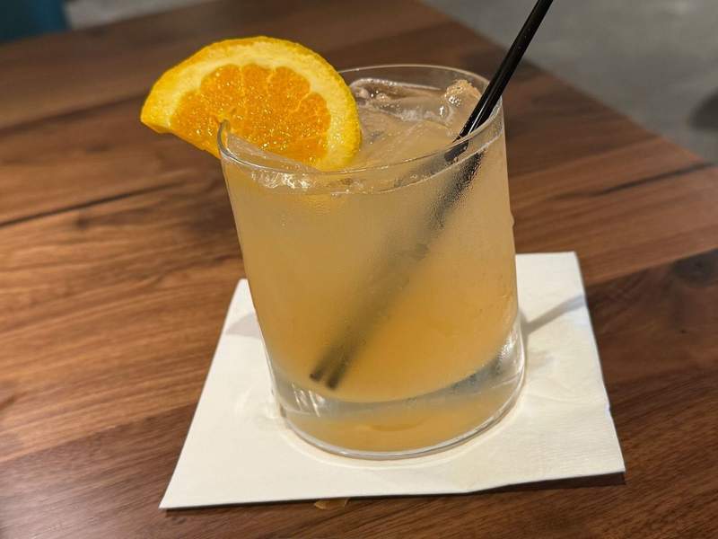 tropical cocktail with orange garnish