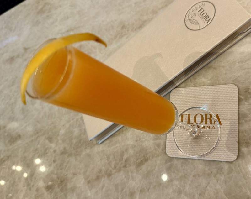 Orange cocktail on Flora restaurant coater