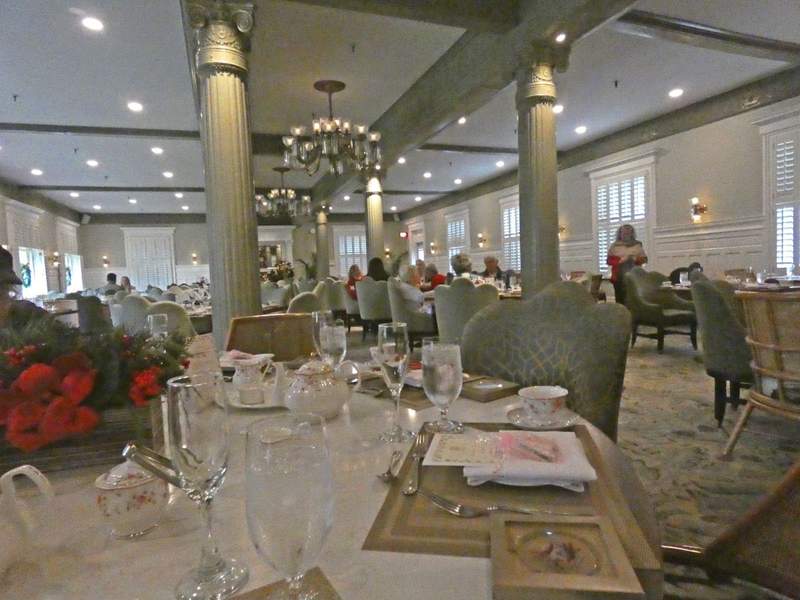 An elegant dining room set with tables set for tea.