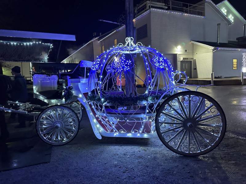 A carriage with blue lights on it.