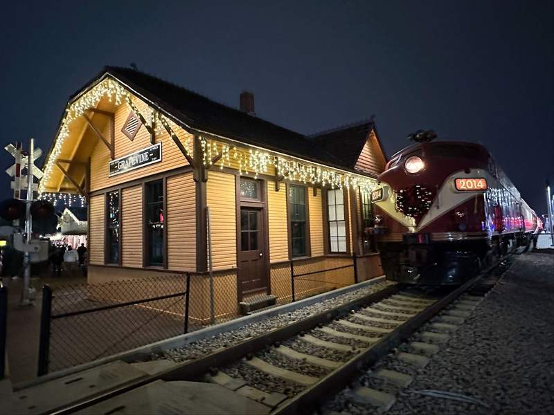 A train beside the train depot in Grapevine the Christmas Capital of Texas.