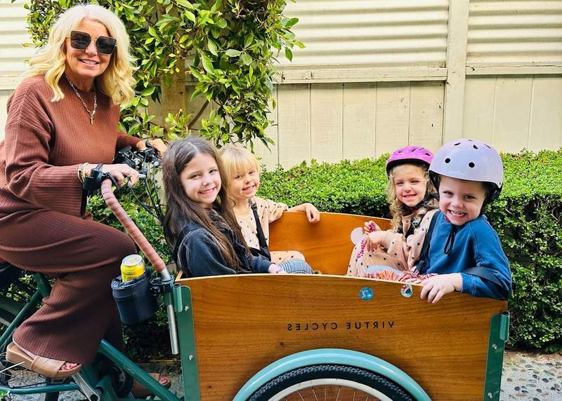Grandmother riding bikes with her grandchildren in Santa Monica