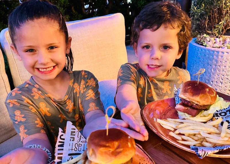 Two children eating kids meals at Shoreside restaurant at Shore Hotel Santa Monica