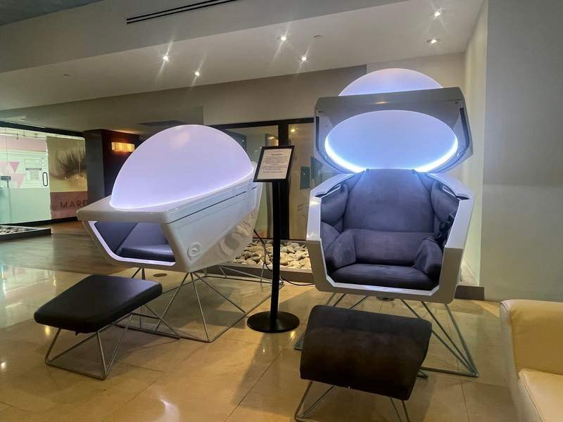 Touchless therapy chairs emit light music and a supposed sense of wellbeing. The chairs are shaped like bubbles.