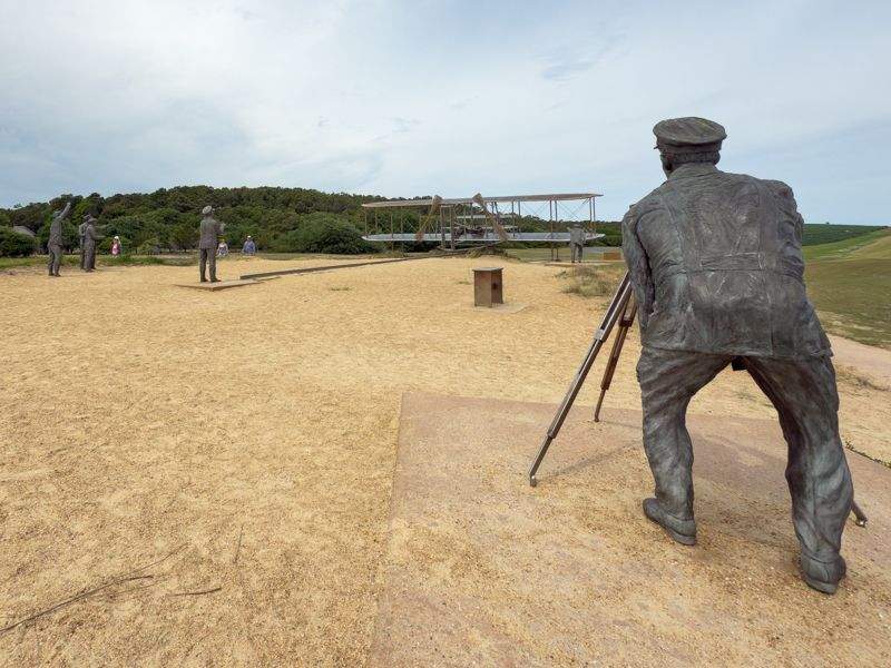 At Kill Devil Hills in Kitty Hawk the Wright Brothers National Memorial outdoor exhibit brings aviation history to life.