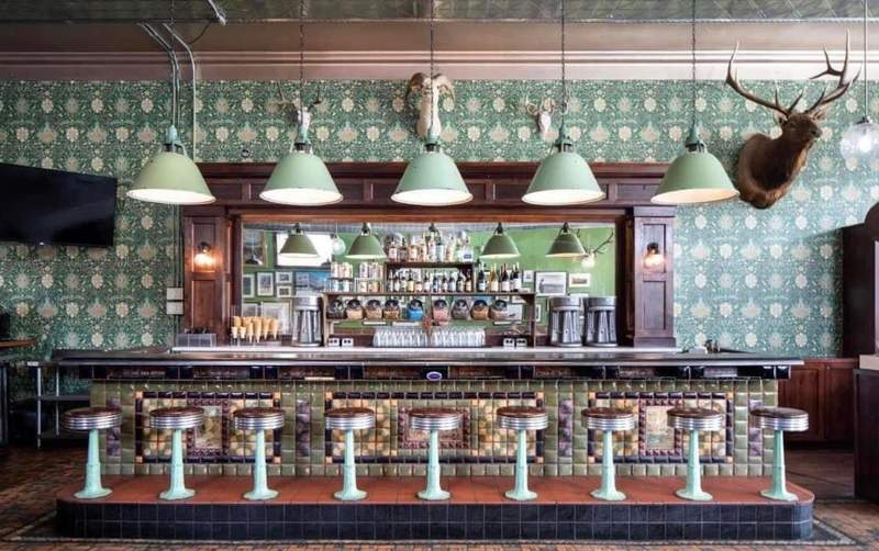 The retro soda fountain counter at Jackson Drug in Jackson Hole Wyoming features vintage bar stools along with burgers and milkshakes.