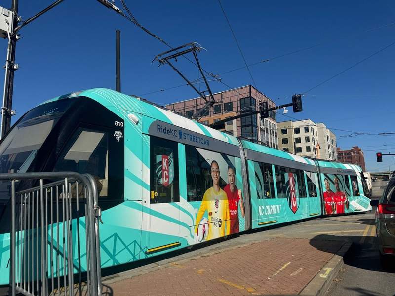 The teal blue Kansas City Street Car which takes you to River Market where free shuttles await.