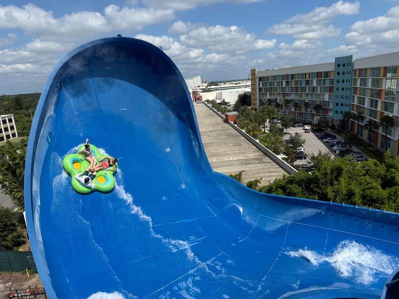 Guests in a raft on a waterslide.