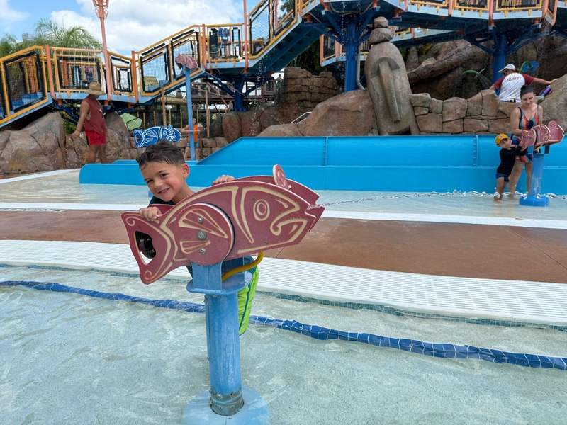 Child playing at splash park