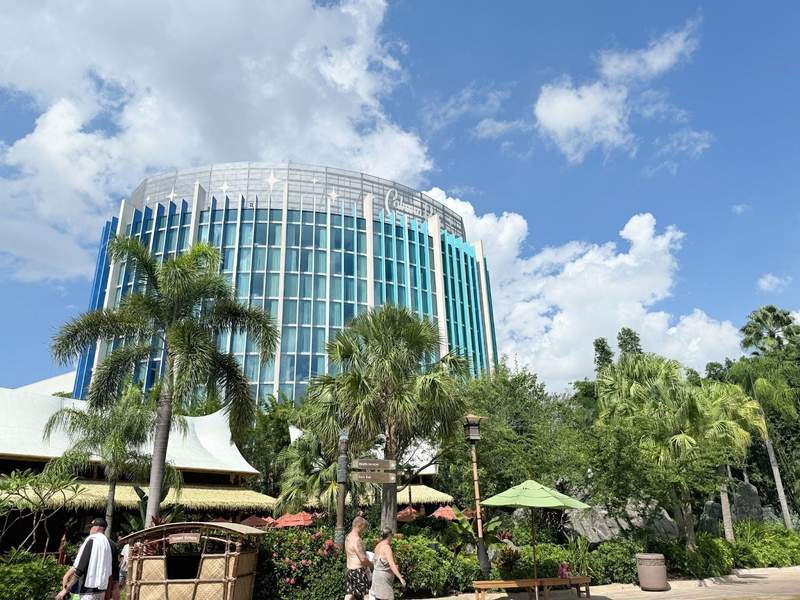 Hotel tower overlooking a water park.