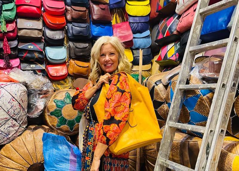 A woman shopping in the Marrakech medina at local market stalls