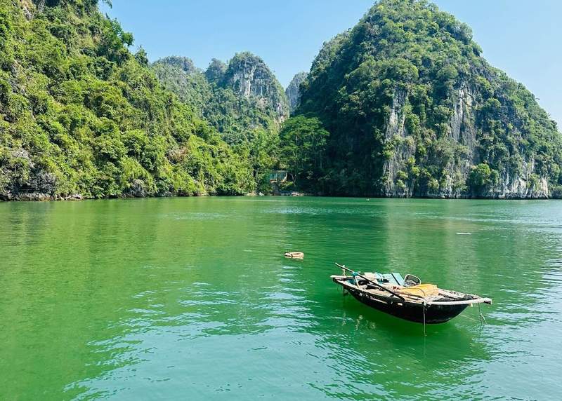 The limestone cliffs and emerald water in Ha Long Bay Vietnam