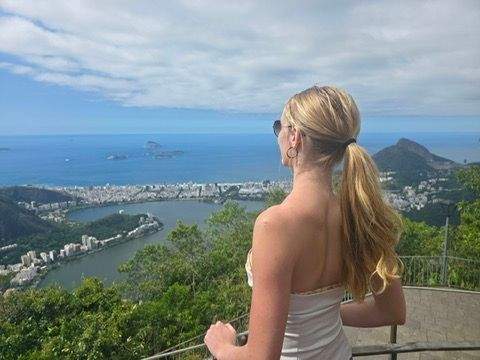 Author standing at a scenic overlook in Rio de Janeiro looking out over the city lagoon coastline and ocean from a high vantage point.