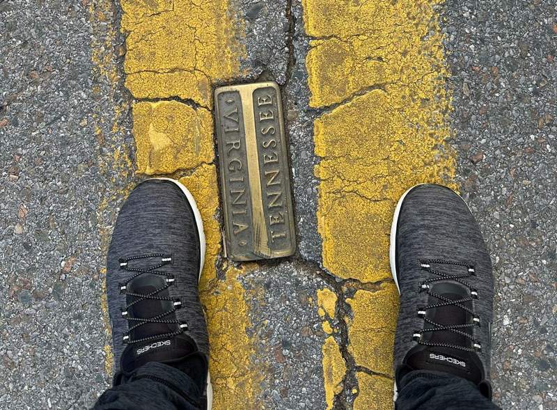 A set of feet in the middle of the road on the Virginia Tennessee line. 