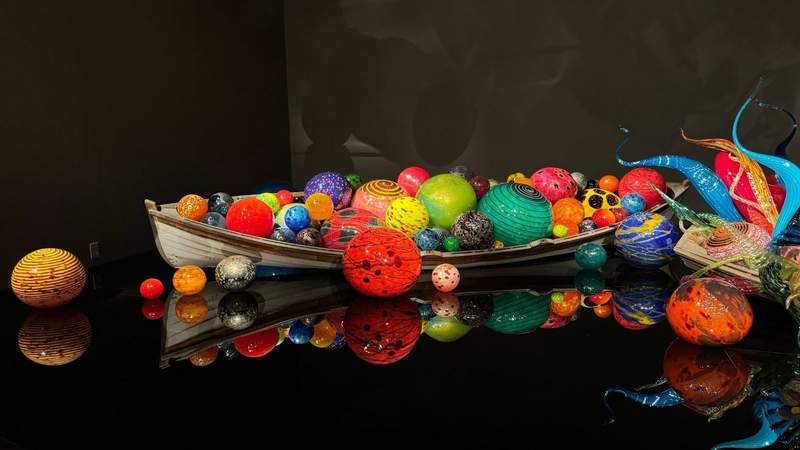 canoe filled with colorful glass blown balls of various sizes at Chihuly Garden and Glass in Seattle.