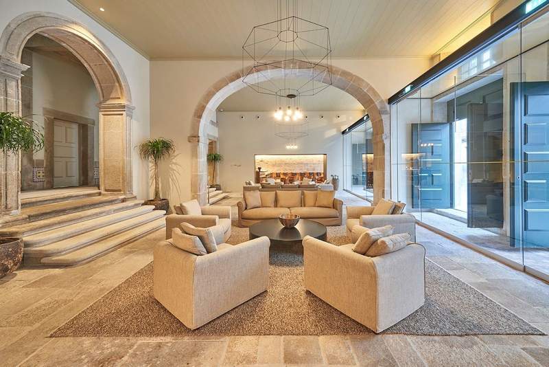 A cream and beige colored lounge at PortoBay Flores hotel in Porto.
