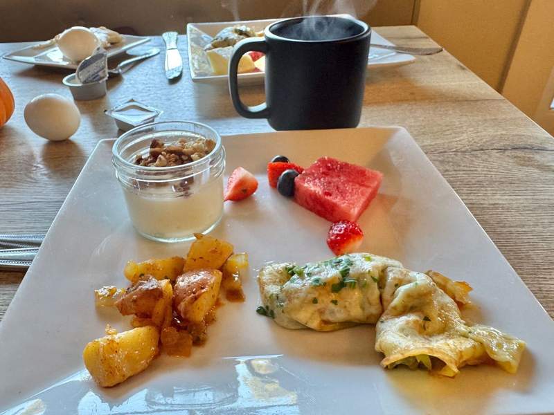 Homemade artichoke omelet with potatoes and fruit at Inn at Sonoma in Sonoma CA.