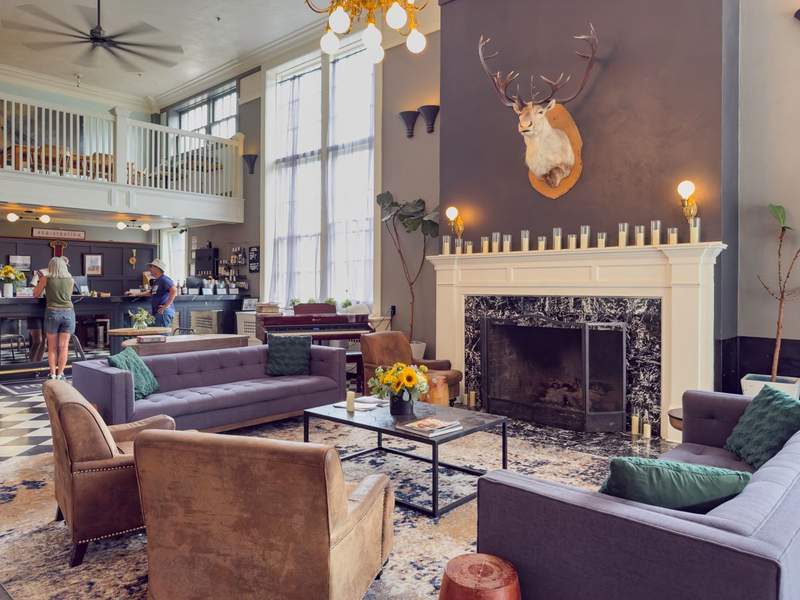 Hood River Hotel lobby with fireplace living room and front desk.