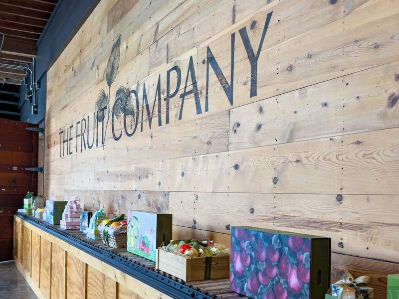 The Fruit Company logo and gift boxes in the lobby.