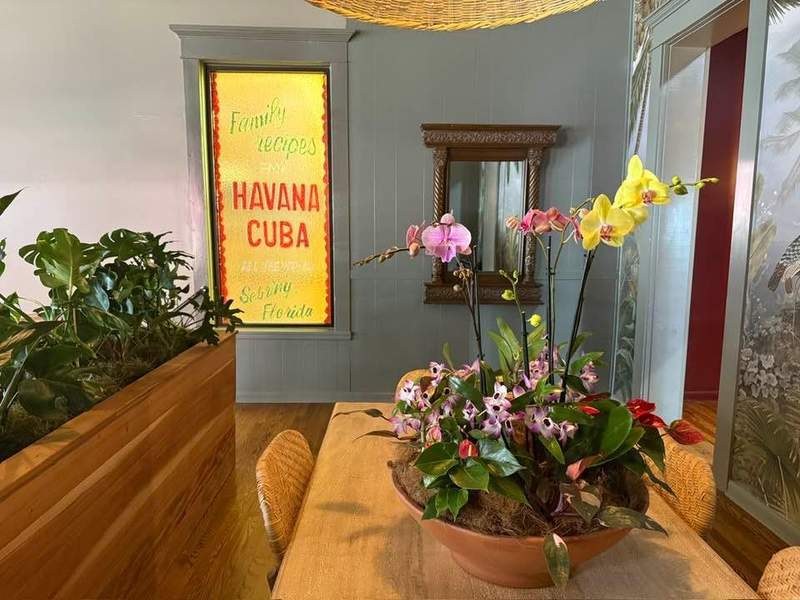 Interior of Sophies Cafe with a yellow glass Havana Cuba sign