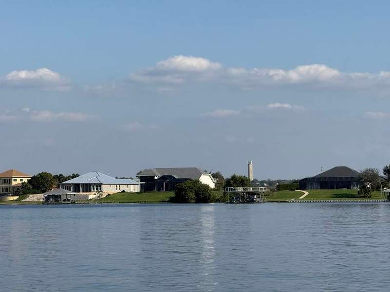 View of June Lake and blue sky with puffy white clouds