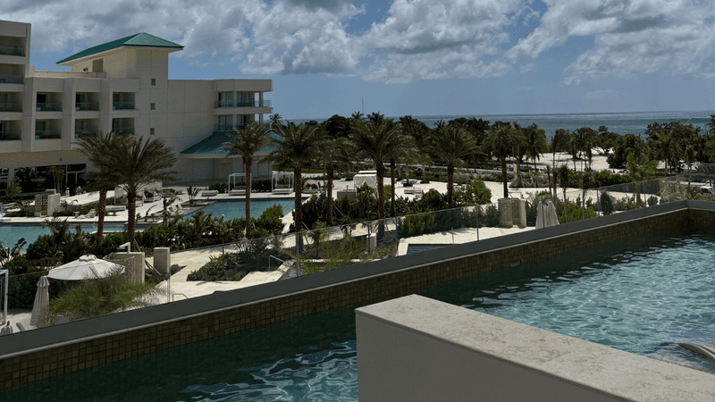 View of hotel and eagle beach with semi private pool.