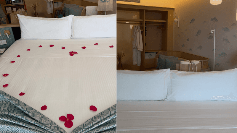 on the left a bed with rose petals and on the right bed neatly made with rest of suite in the background