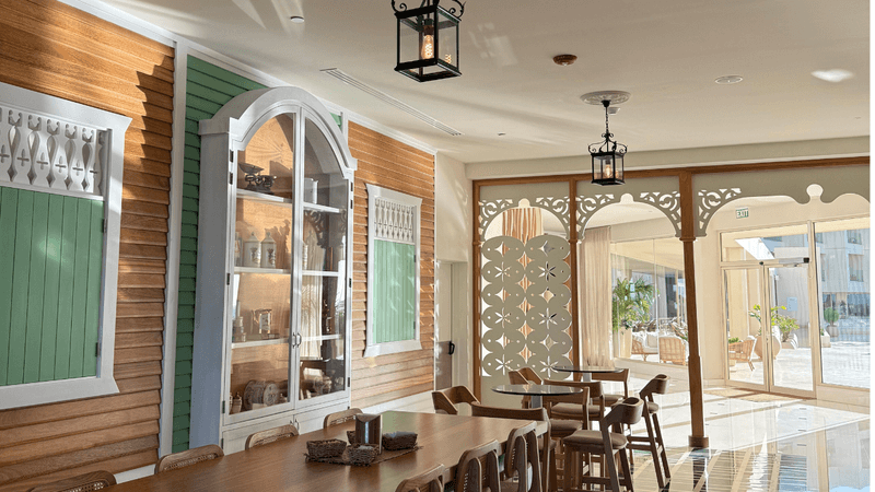 bar view during day with coastal colored walls and wooden furniture