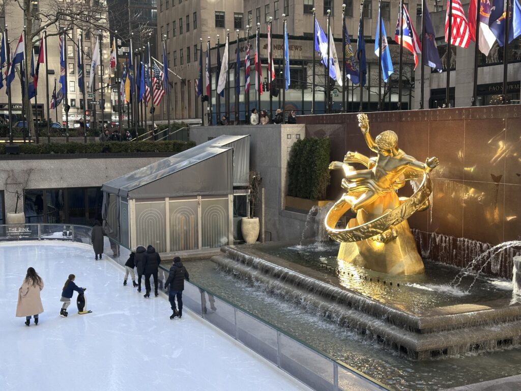Ice skaters at Rockefeller Center in New York City during winter.