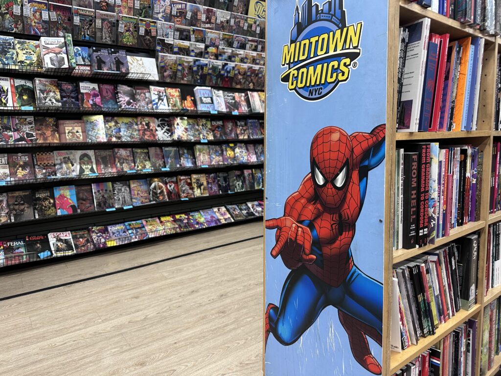 Interior of New York's Midtown Comics in Times Square with shelves full of classic comic books.