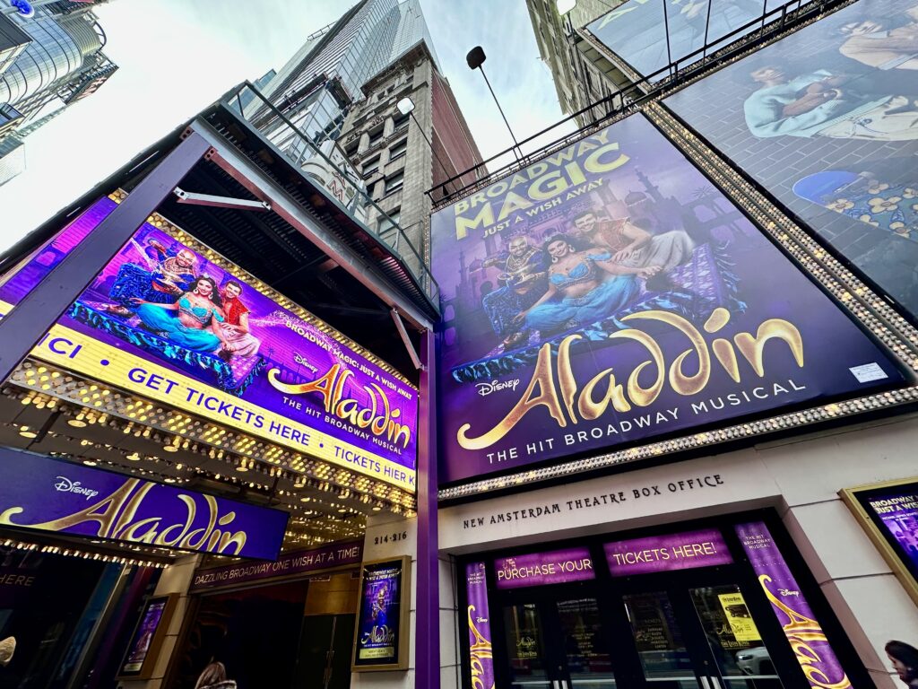 Brilliant purple marquee for Disney's Aladdin musical, a perennial Broadway favorite for families in Times Square.