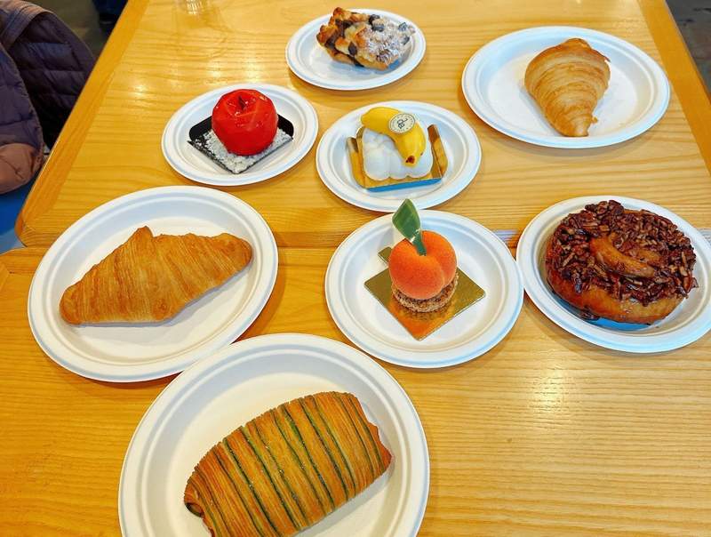A variety of pastries on white plates