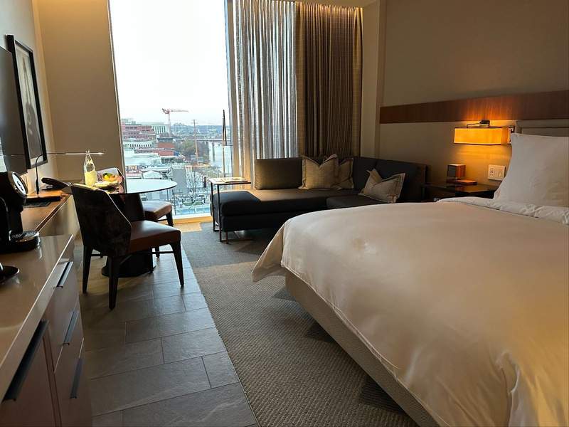 A hotel room overlooking the city. 