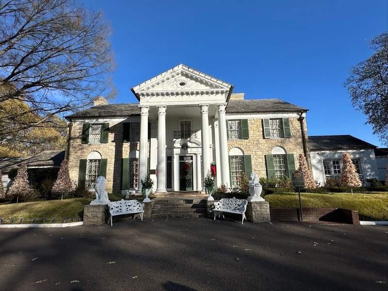 A home with huge white pillars in the front. 